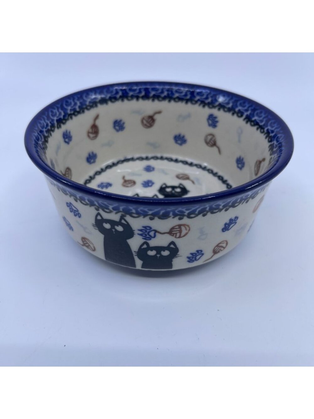 handmade polish pottery bowl with day dreaming kitties design blue floral rim